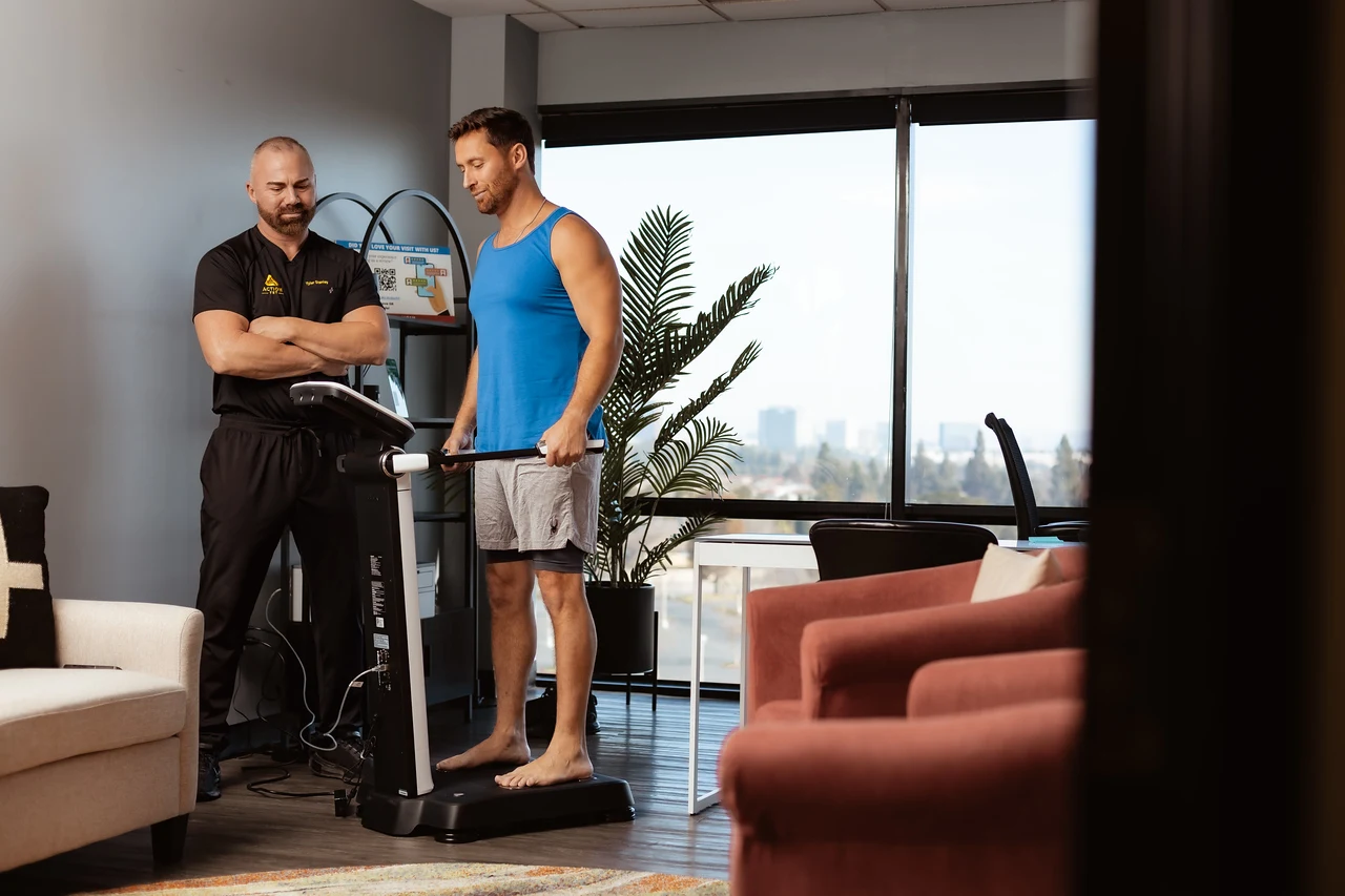 A patient completing a body composition assessment at Action TRT